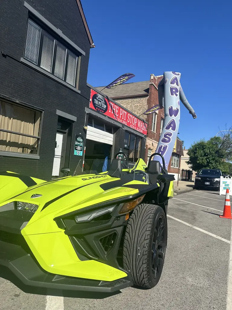 Lime green Polaris Slingshot parked outside The Pit Stop on Elston